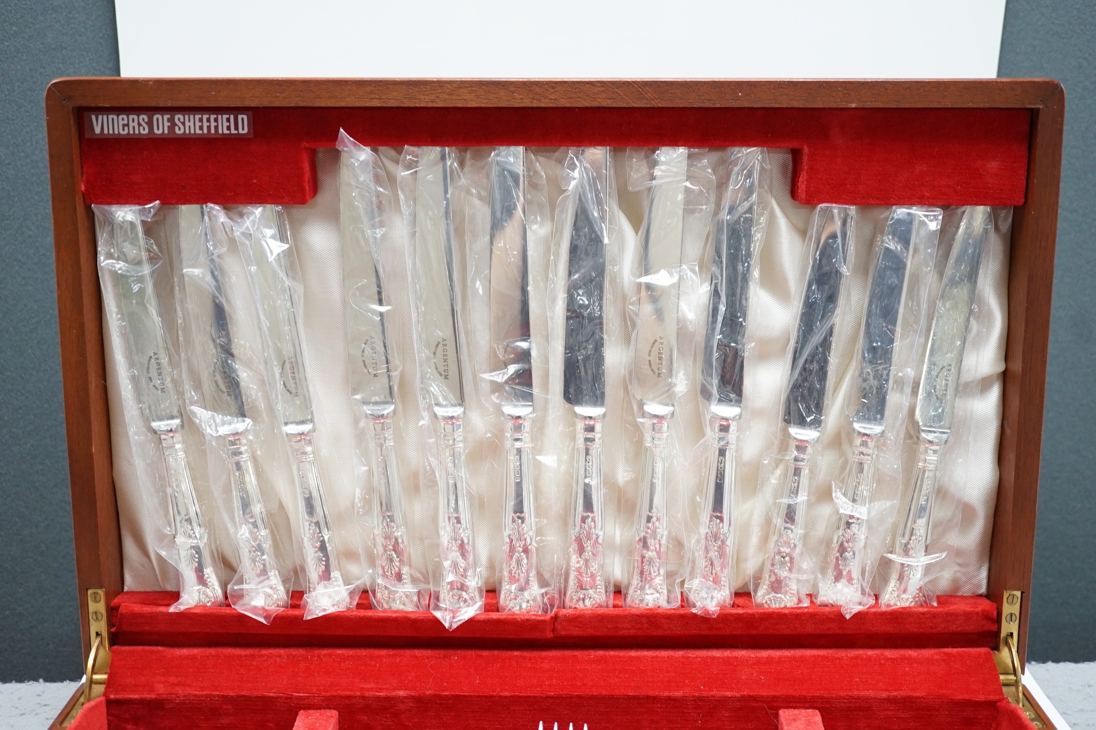 An Elizabeth II canteen of silver King's pattern cutlery for six, by Argentum Ltd, Sheffield, 1995/96, comprising fifty items, weighable silver, 81.6oz, in a fitted wooden canteen.